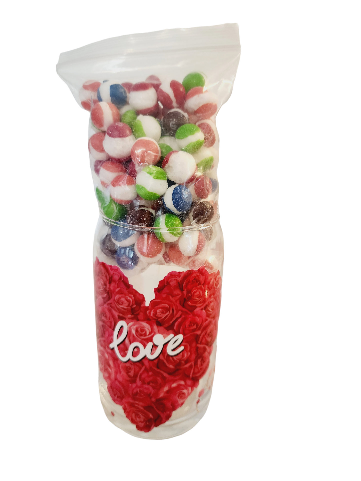 16oz Love glass tumbler filled with berry skittles